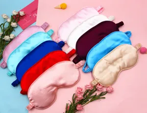 Detailed view of various colorful faux silk sleep masks for light blocking and sleep