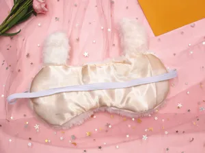 Back view of plush alpaca sleep mask showing soft satin lining and elastic strap