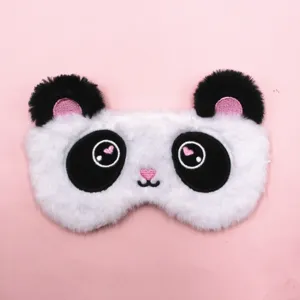 Cute plush panda sleep eye mask for blackout rest shown on a minimal soft pink background