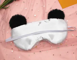Rear view of plush panda sleep mask showing smooth satin lining and elastic strap.
