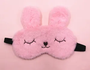 Front view of cute pink plush rabbit sleep mask with embroidered closed eyes and nose