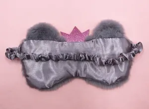 Detailed back view of cute grey plush crown sleep mask showing elastic satin strap
