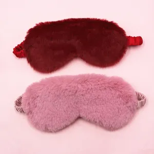 Plush faux rabbit fur sleep masks in pink and burgundy with elastic silk straps