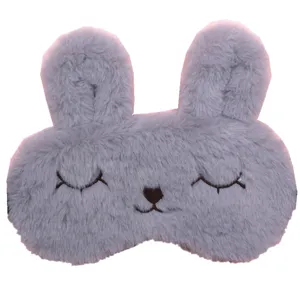 Close-up of soft gray plush bunny eye mask for comfortable sleep blackout