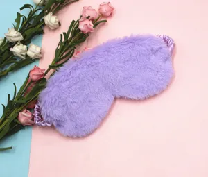 Macro view of soft purple plush sleep mask with fuzzy texture for ultimate comfort