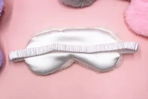 Detailed back view of a plush white eye mask with a comfortable elastic silky strap