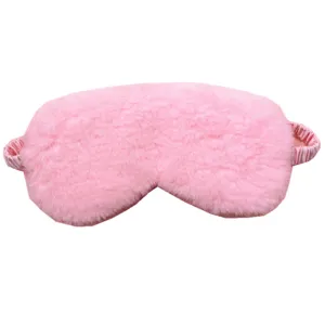 Close-up of a soft pink plush sleep mask showing high-quality fuzzy texture and elastic band
