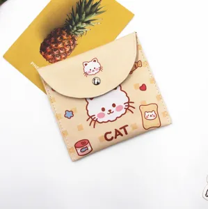 Close-up of a cute cream-colored storage pouch with a cartoon cat design and metal snap