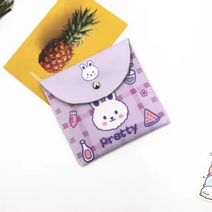 Macro view of cute purple cartoon rabbit storage pouch with snap button closure