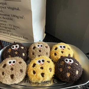 Set of cute plush cookie charms in brown and yellow with cartoon faces for keychains