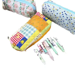 Quilted cotton pencil cases with floral and checkered patterns, large capacity storage.