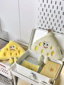 Cute cheese plush coin purse detail shot, funny cartoon expression mini crossbody bag.