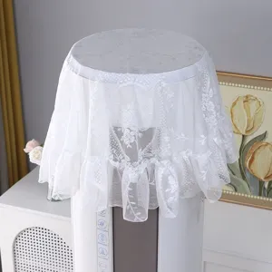 Detailed close-up view of elegant white lace dust cover with floral embroidery