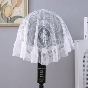 White French lace dust cover with floral embroidery and ruffle trim shown on fan