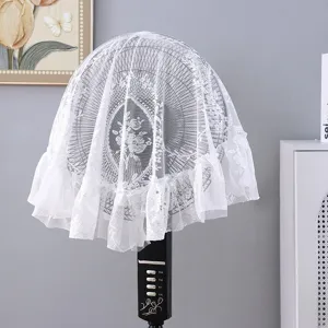 Elegant white French lace dust cover with floral embroidery used on a floor fan