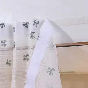Detail of Velcro strip on French style floral lace curtain for easy installation