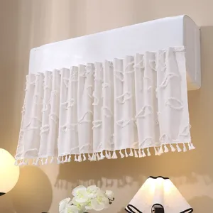 Detail view of French lace air conditioner cover with elegant fringe tassels