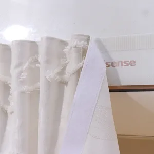Macro detail of white textured lace curtain featuring easy magic tape installation