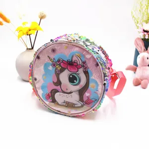 Close-up detail of a pink glitter child's crossbody bag featuring a cute unicorn and colorful sequins.