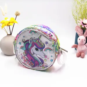 Close-up of children's sequin unicorn bag showing rainbow glitter texture and pearl details.