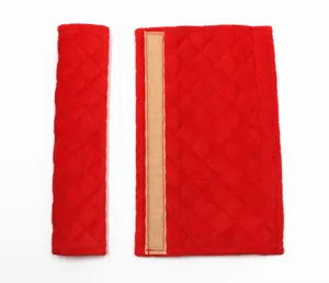 Soft red quilted plush car seat belt shoulder pad protector with Velcro closure detail