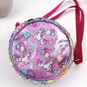 Close-up of a sparkling purple sequin unicorn crossbody bag with rainbow motifs for girls