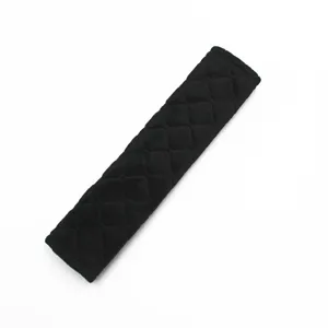 Detailed view of a premium black quilted plush car seat belt shoulder pad cover
