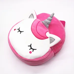 Close-up of a pink plush unicorn backpack with glitter horn for kids