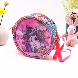 Detail showing the colorful sequins and cute unicorn print on a pink crossbody bag.