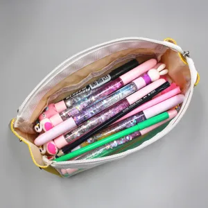Internal view of a large capacity transparent pencil case filled with colorful stationery