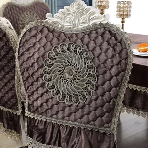 Macro view of luxurious brown velvet quilted chair cover with intricate embroidery