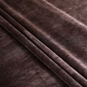 Macro detail shot of premium dark brown velvet fabric texture for elegant chair covers