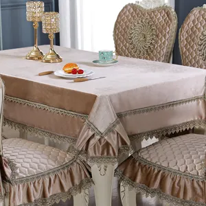 Close-up detail of European style velvet tablecloth with elegant gold lace trimming