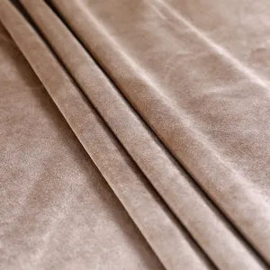 Close-up macro view showing the soft plush texture of premium velvet chair cover fabric