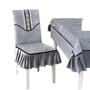 Elegant grey quilted dining chair cover and matching tablecloth set with lace and ruffled skirt
