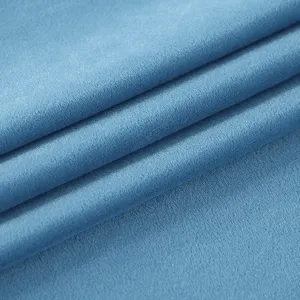Close-up of soft blue velvet fabric showing fine texture and material detail