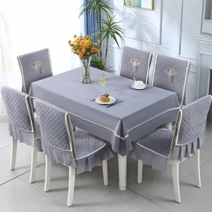Elegant grey quilted tablecloth and chair cover set with ruffles and embroidery detail