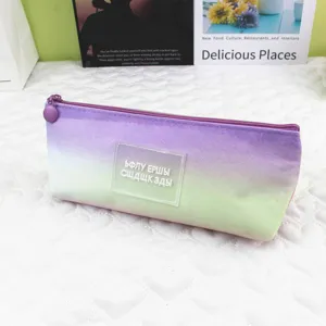 Detailed view of tie-dye pencil case featuring purple-green gradient and frosted patch