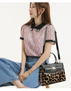 Fashionable leopard print tote bag styled with a pink lace top and blue jeans