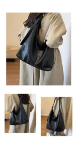 Vintage black hobo tote bag detail showing leather texture and shoulder wear style