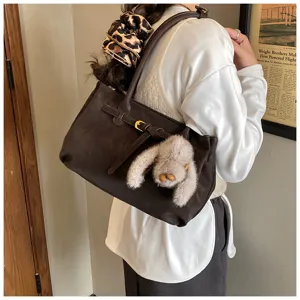 Vintage matte suede tote bag with decorative belt and fluffy rabbit charm detail