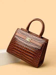 Elegant brown crocodile texture tote bag with a golden flower lock for daily commute.