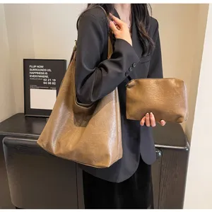 Large vintage khaki leather tote bag and matching clutch pouch for women's daily commute
