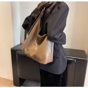 Large vintage brown faux leather tote bag with soft texture for stylish commuting