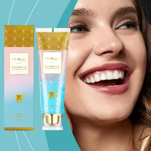 Close-up of Oralhoe Niacinamide whitening toothpaste and packaging with white teeth smile
