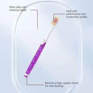 Detailed view showing the slim soft bristles and purple glitter handle of the oral care brush