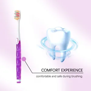 Detail view of the fine soft bristle toothbrush designed for a comfortable experience