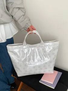 Elegant white double-layer PVC tote bag with floral cutout design for women commuting