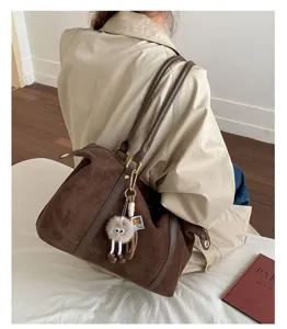 Vintage brown suede large bowling bag with fuzzy monster charm for women commute