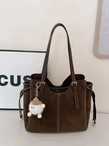 Large brown faux leather tote bag for daily commute with a cute white sheep charm